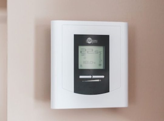 a thermostat on a wall