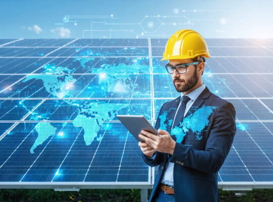 System integrator using a tablet to manage and monitor solar PV installation, with digital graphics representing data and connectivity illustrating digital transformation in solar energy operations.