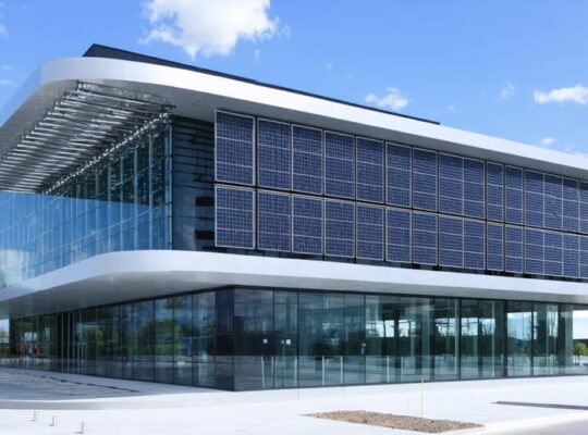 A contemporary building showcasing building-integrated photovoltaic panels integrated into its structure. The facade features sleek solar panels and glass elements, exemplifying the fusion of innovative solar technology and modern architecture.