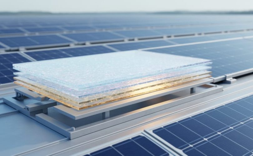 Photorealistic solar array with semi-transparent glowing layered photovoltaic material panels representing next-generation perovskite and tandem cell technologies.